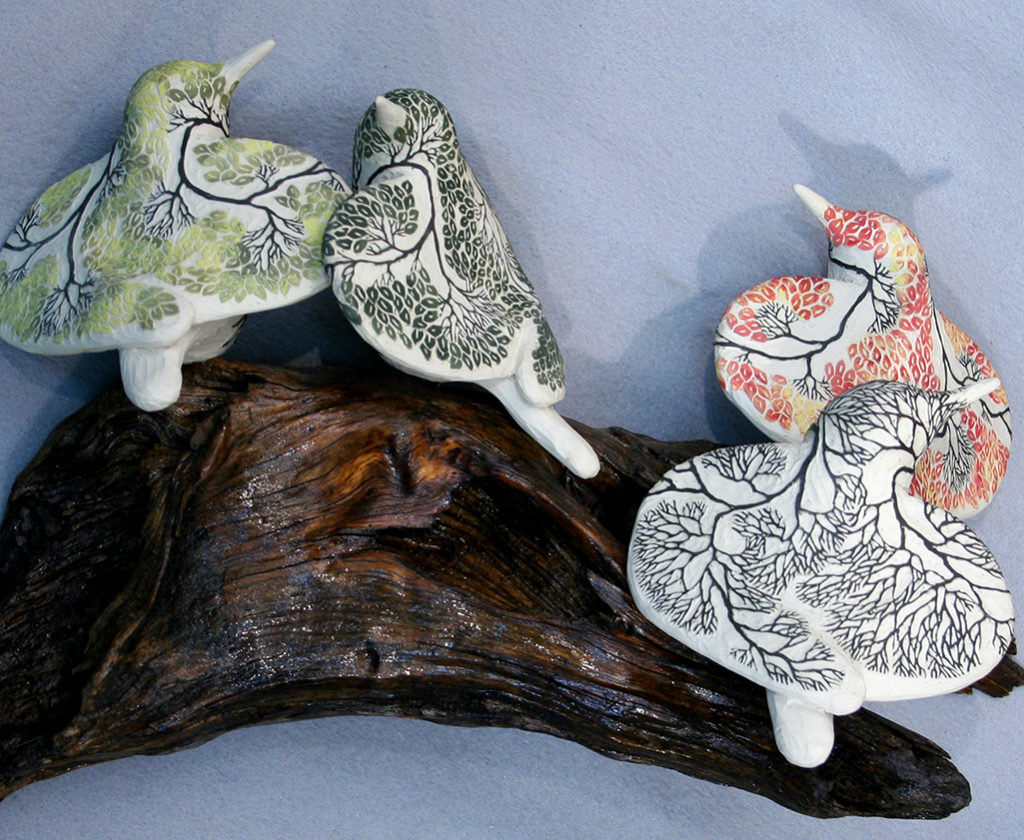cathy weber - art - clay - woman - montana - ceramic - porcelain - bird - red wing - phases - forest - carved -forest - tree - seasons - fall - winter - spring - summer